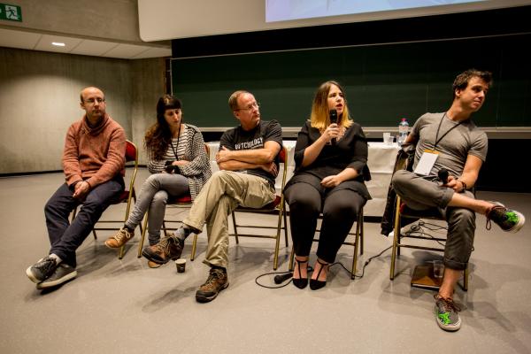 Image of people taking part in a panel discussion